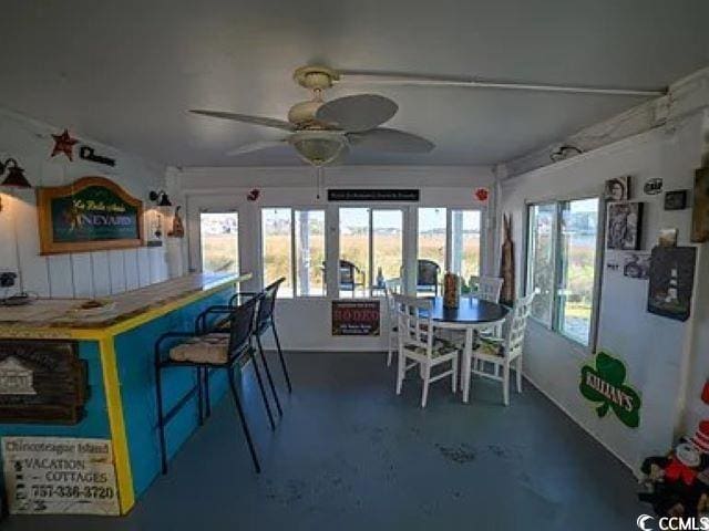 interior space featuring ceiling fan