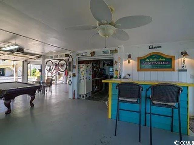 playroom featuring ceiling fan, pool table, and concrete floors