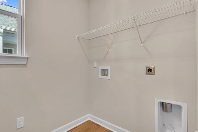 clothes washing area with hardwood / wood-style floors, electric dryer hookup, and hookup for a washing machine