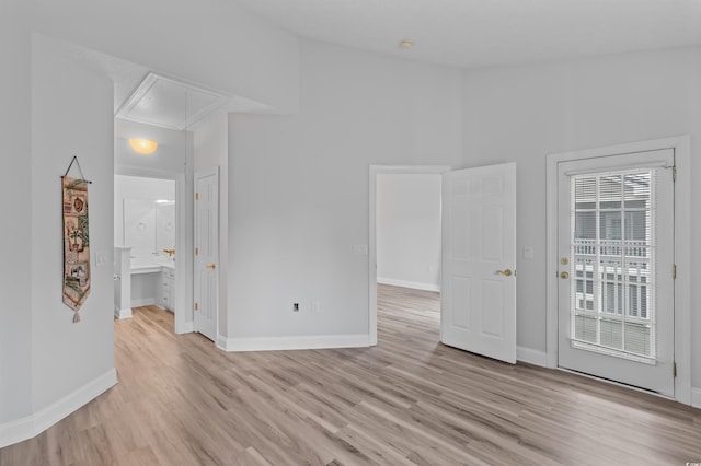 spare room with light hardwood / wood-style flooring