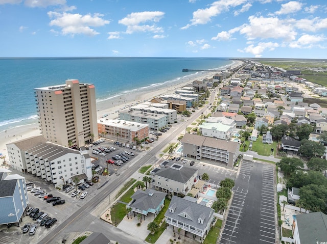 drone / aerial view with a water view and a view of the beach