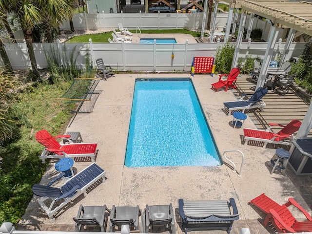 view of swimming pool featuring a patio area