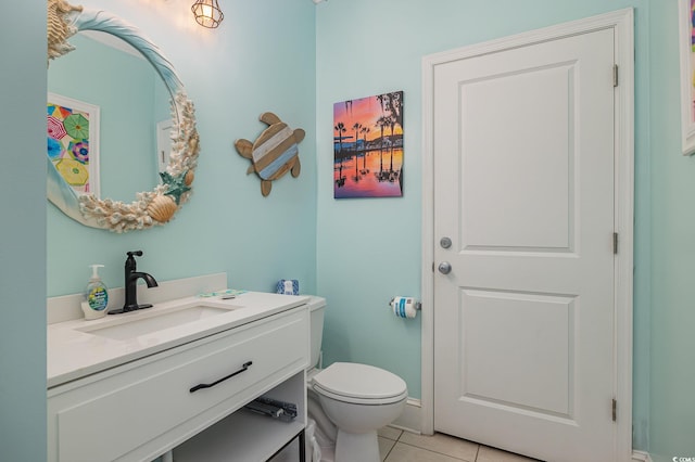 bathroom with tile patterned floors, toilet, and vanity