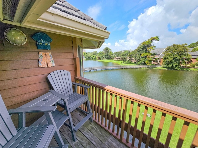 wooden terrace with a water view