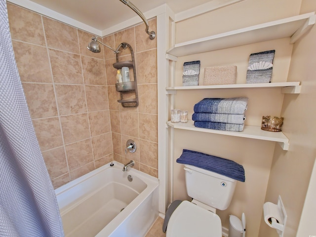 bathroom featuring shower / bath combination with curtain and toilet