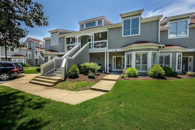 view of property featuring a front yard