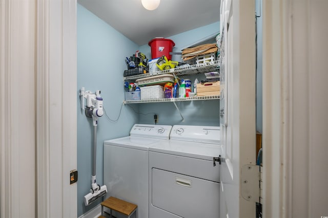 clothes washing area featuring washing machine and clothes dryer