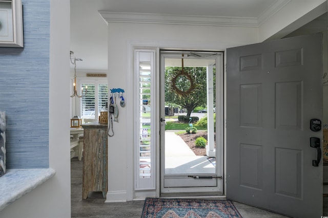 foyer featuring ornamental molding