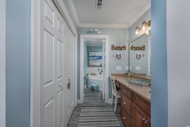 bathroom featuring vanity and crown molding