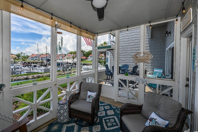 sunroom / solarium with ceiling fan and a wealth of natural light