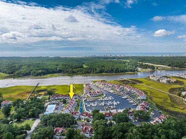 birds eye view of property with a water view