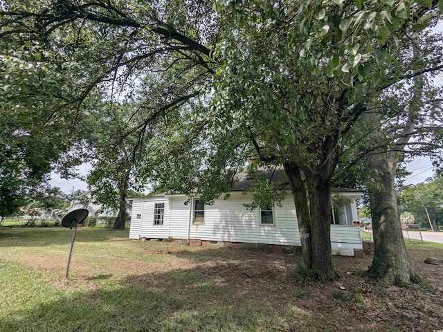 exterior space featuring crawl space and a yard