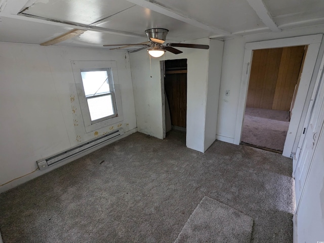 unfurnished bedroom with ceiling fan, carpet floors, baseboard heating, and a closet