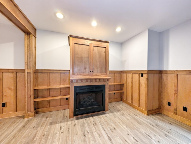unfurnished living room with light wood-type flooring