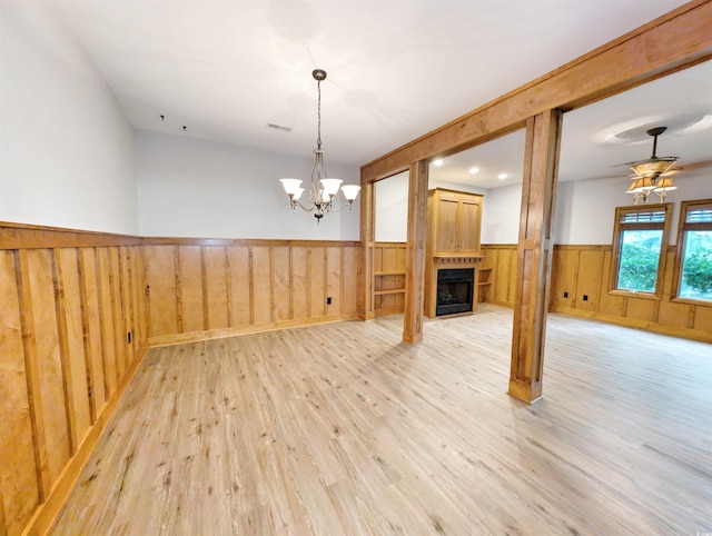 interior space with a chandelier and light wood-type flooring