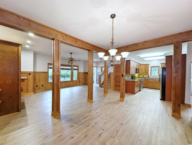 dining space featuring light hardwood / wood-style floors and a chandelier