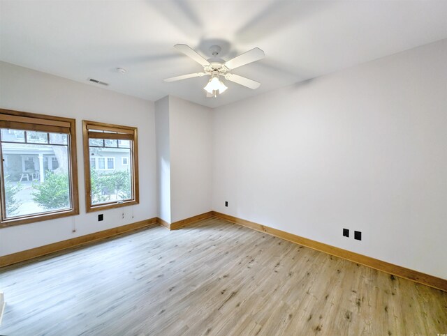 unfurnished room featuring light hardwood / wood-style floors and ceiling fan