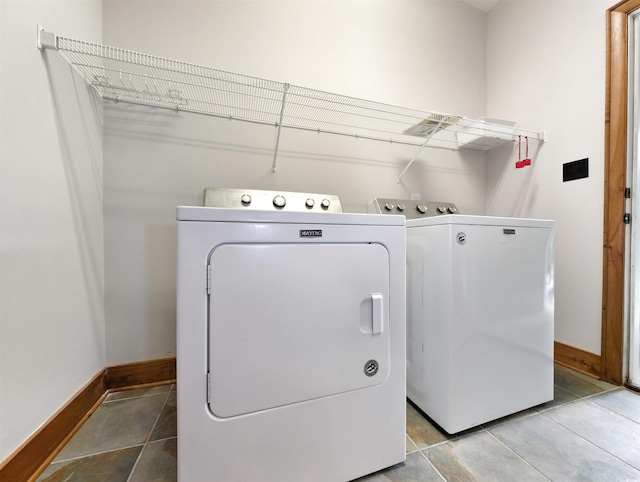 washroom with independent washer and dryer