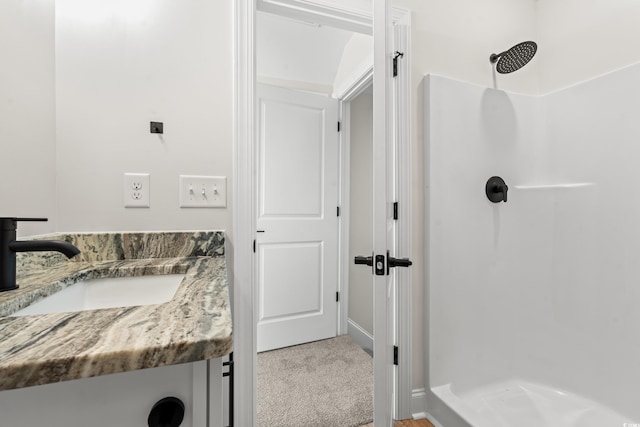 full bath with a shower and vanity