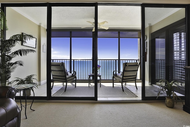 sunroom featuring ceiling fan