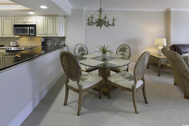 dining area featuring ornamental molding, a textured ceiling, and a notable chandelier