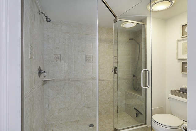 bathroom with toilet and walk in shower