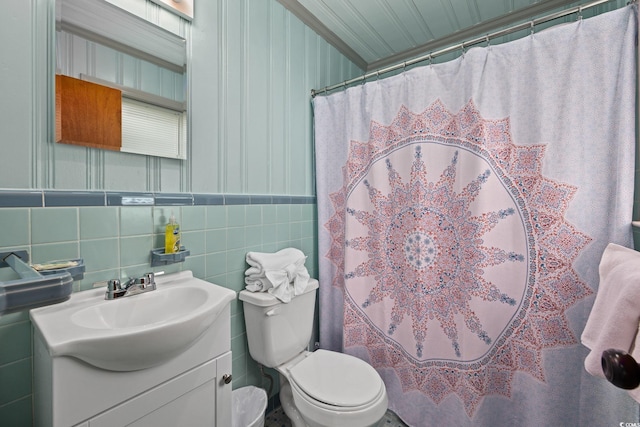 bathroom featuring toilet, vanity, curtained shower, decorative backsplash, and tile walls