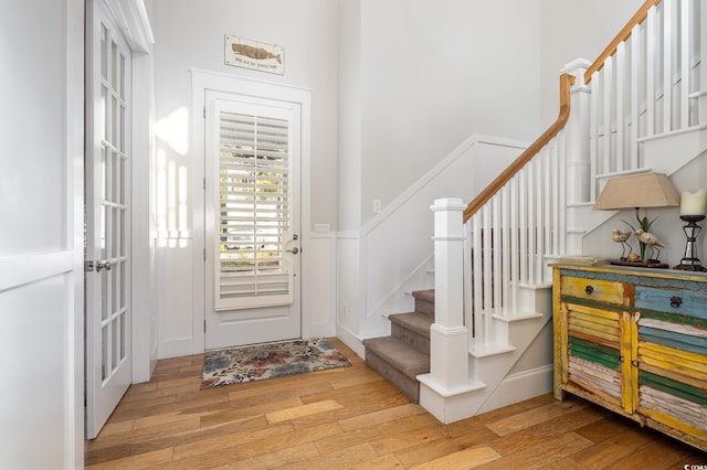 foyer with light hardwood / wood-style floors