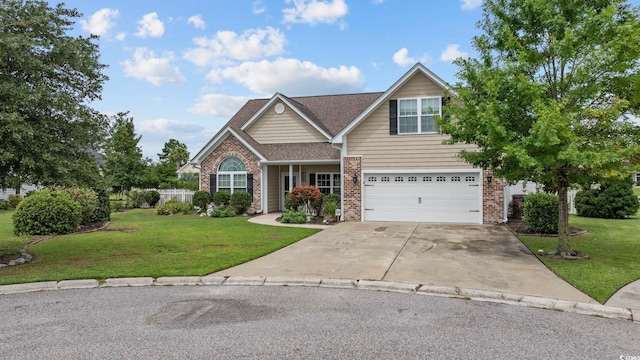 craftsman house with a garage, concrete driveway, brick siding, and a front lawn