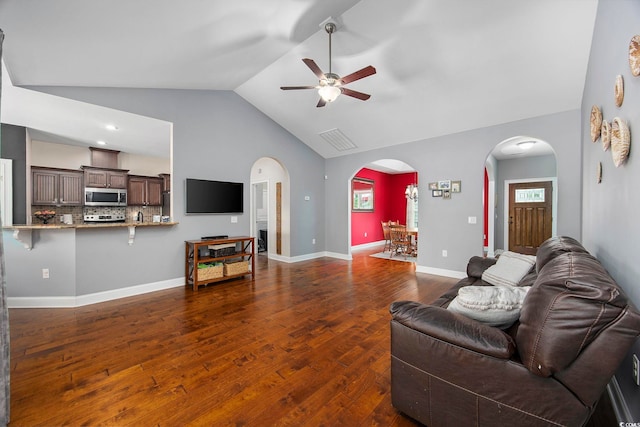 living room with lofted ceiling, wood-type flooring, and ceiling fan