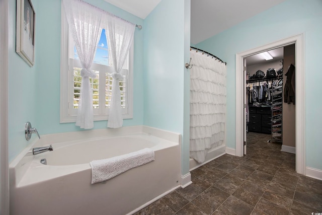 bathroom featuring a tub and tile patterned floors