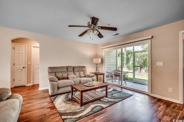 living room with ceiling fan and hardwood / wood-style floors