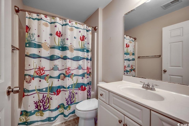 bathroom with vanity, tile patterned flooring, toilet, and a shower with shower curtain