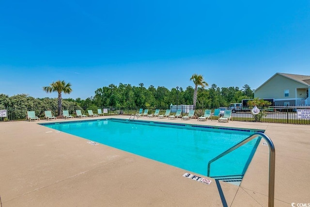 view of swimming pool featuring a patio