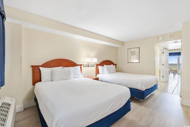 bedroom with light hardwood / wood-style flooring