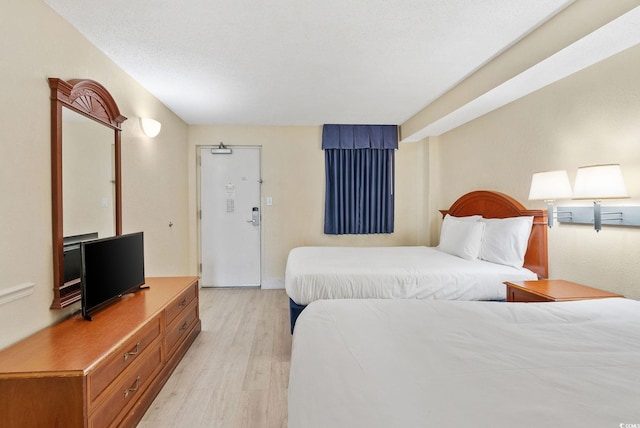 bedroom with light wood-type flooring