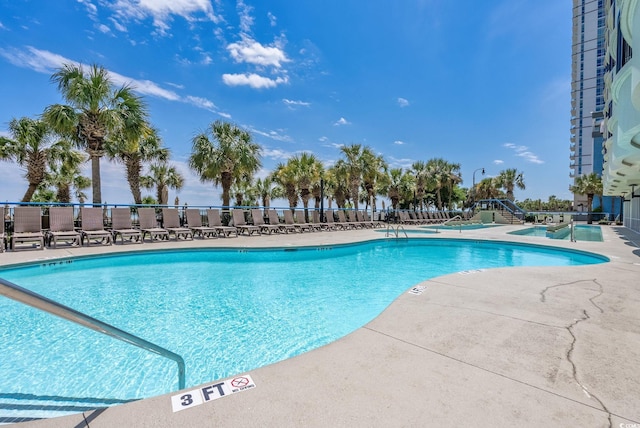 view of swimming pool with a patio area