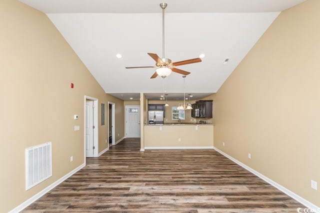 unfurnished living room featuring high vaulted ceiling, ceiling fan, and wood-type flooring