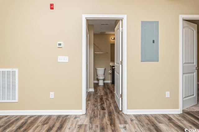 hall featuring dark hardwood / wood-style flooring and electric panel