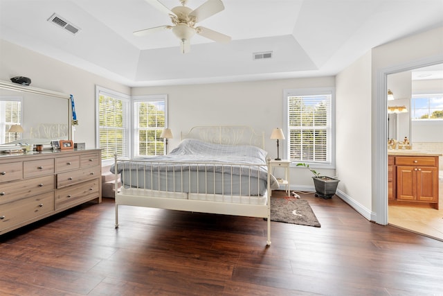 bedroom featuring multiple windows, ceiling fan, and dark wood-type flooring