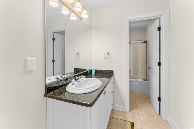 bathroom with tile patterned flooring and vanity