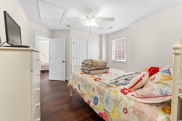 bedroom featuring a closet, ceiling fan, and dark hardwood / wood-style flooring