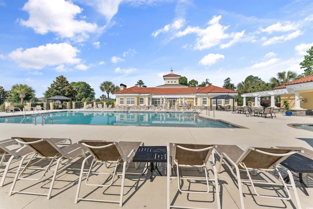 view of swimming pool featuring a patio area