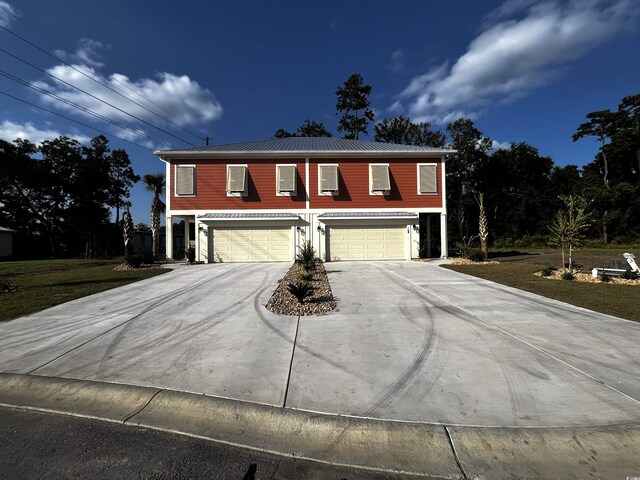 108 Hallandale Ln, Murrells Inlet, SC 29576 - traditional home featuring an attached garage, concrete driveway, and metal roof