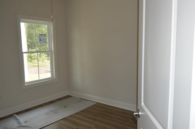 108 Hallandale Ln, Murrells Inlet, SC 29576 - empty room with dark wood finished floors and baseboards