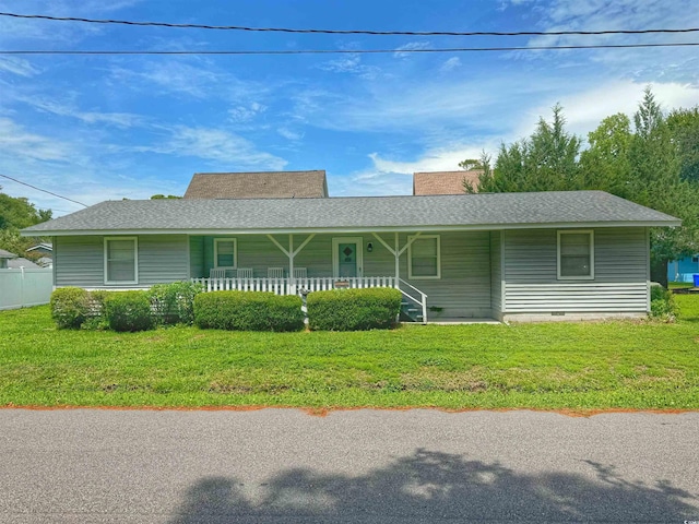 view of front of home featuring crawl space, covered porch, a shingled roof, and a front yard