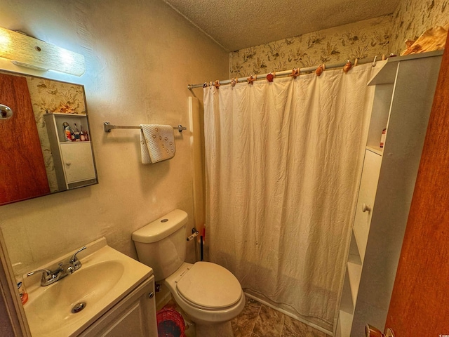 full bath featuring toilet, a textured ceiling, and vanity