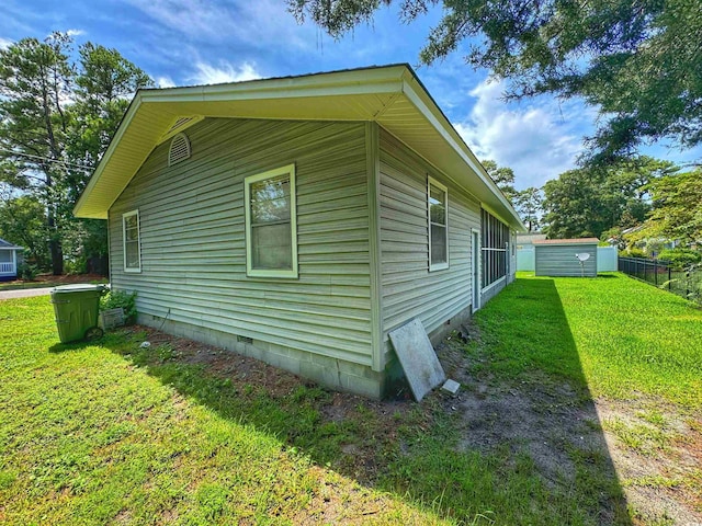 view of home's exterior featuring crawl space and a lawn