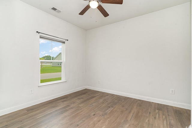 unfurnished room with hardwood / wood-style flooring and ceiling fan