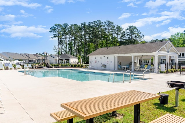 view of swimming pool with a patio area